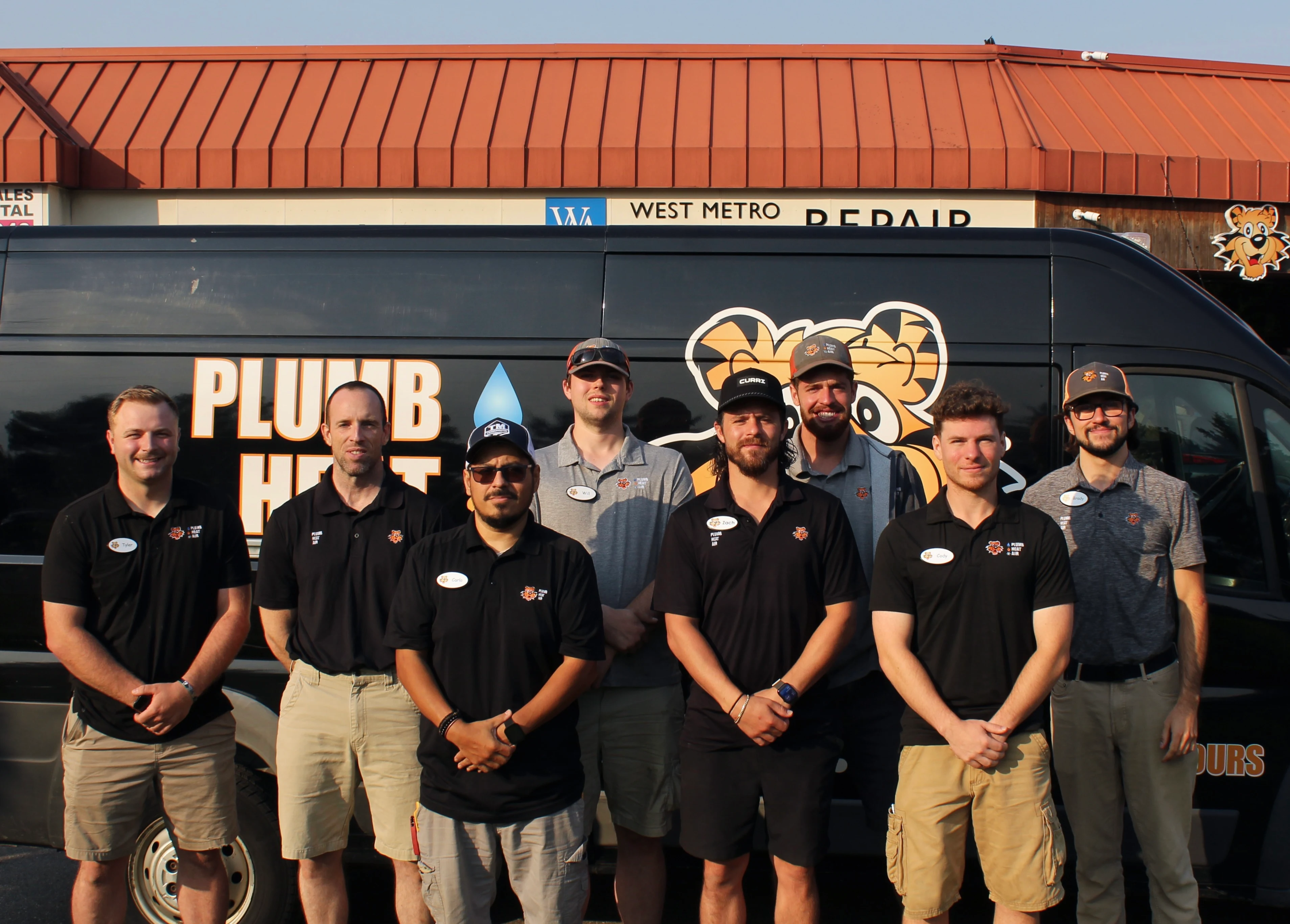 The Tiger Plumbing Heating & Air team together